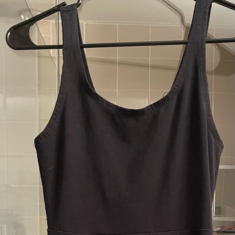 Express black fit & flare skater style dress with cool teal zipper back.